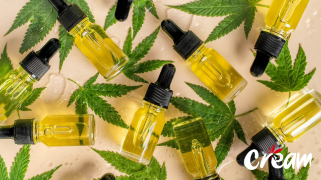 Vials of cannabis oil and cannabis leaves at CREAM cannabis dispensary in Jersey City.